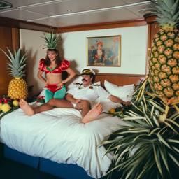 The Captain in bed, pineapple and lobster costumes, FFF Cruises: Voyage 01 · FFF\CRS\050\002