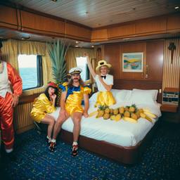 The Captain in bed, pineapple and lobster costumes, FFF Cruises: Voyage 01 · FFF\CRS\050\015