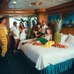 The Captain in bed, pineapple and lobster costumes, FFF Cruises: Voyage 01 · FFF\CRS\050\027